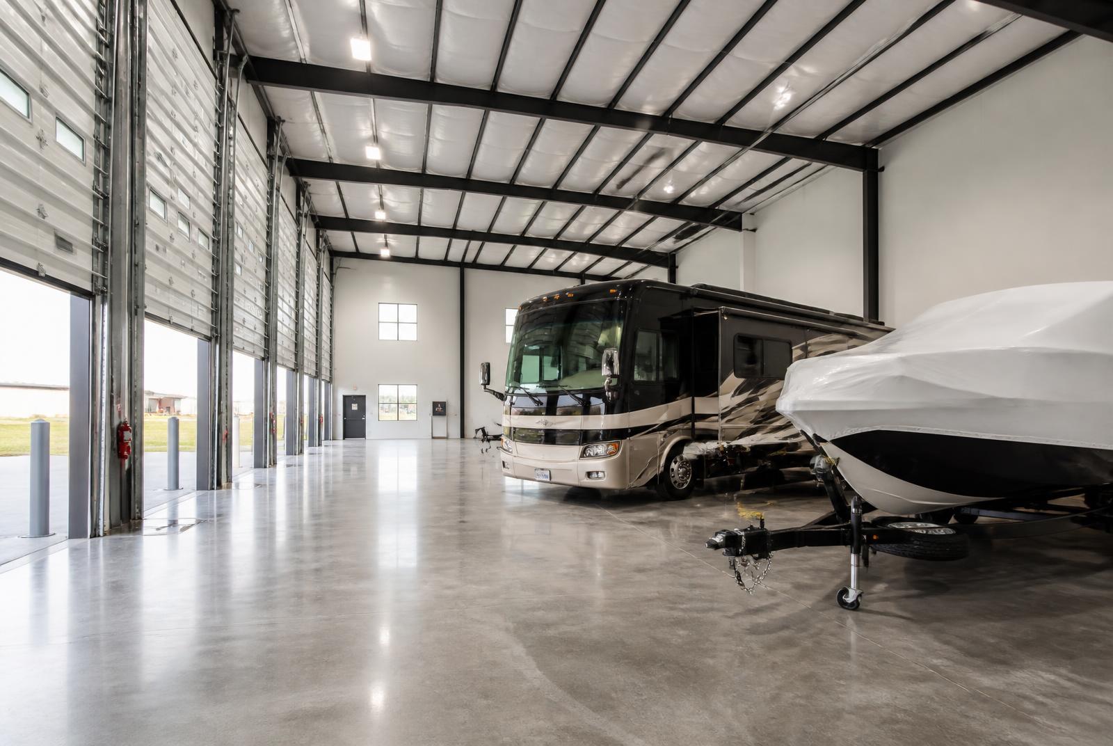 A Class A motorhome parked inside a clean indoor storage building